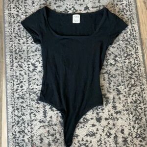 Pink Victoria’s Secret body suit